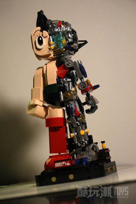 The completed Astro Boy transparent mecha building set displayed on its black base