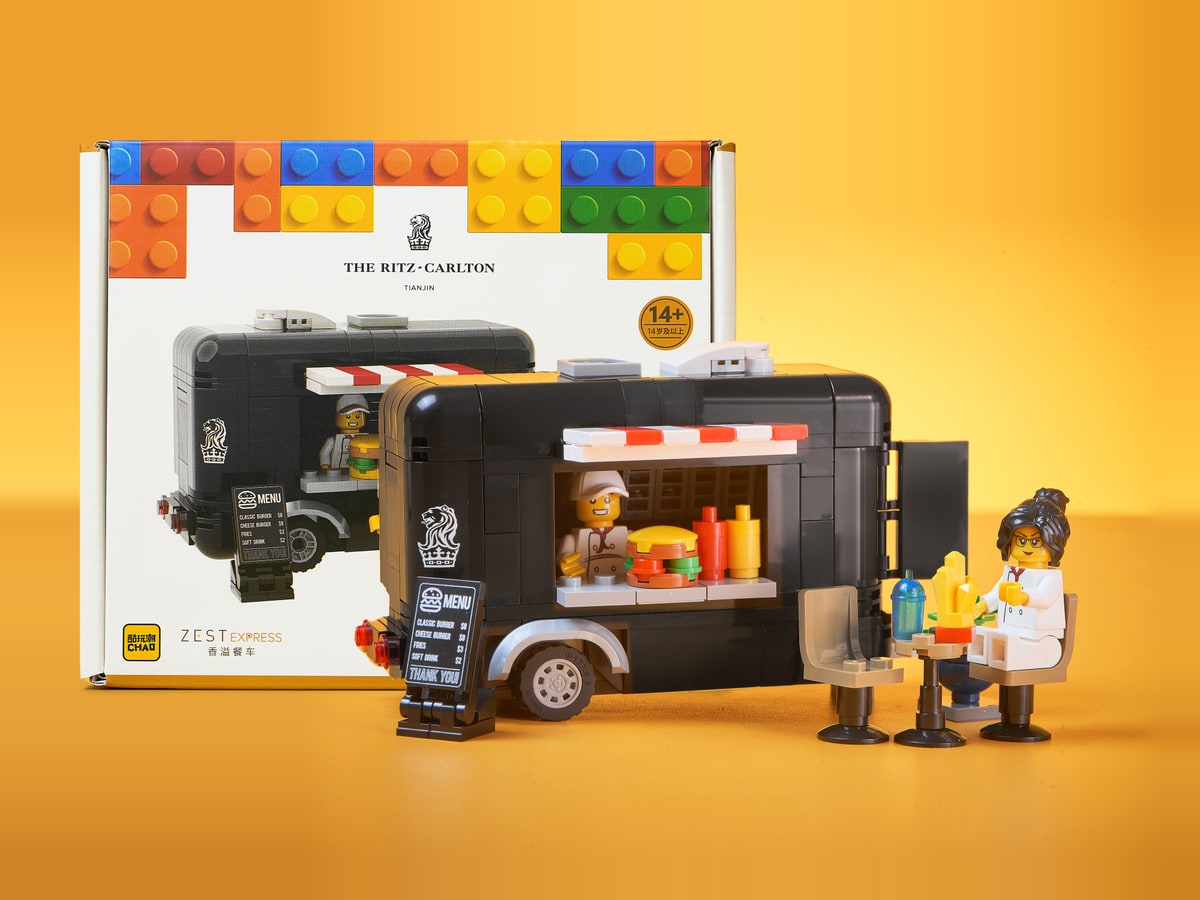 ZEST EXPRESS brick food-trailer set with hotel branding, dining accessories and packaging
