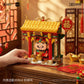 Chinese Wealth God Shrine building set displayed on a festive desk scene