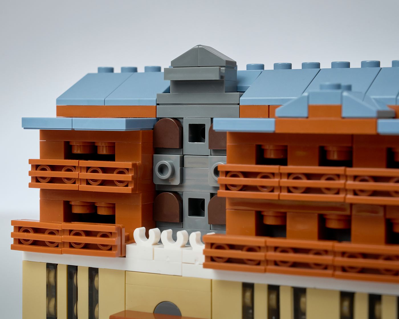 Close view of the model's layered verandas, roofline and central facade details