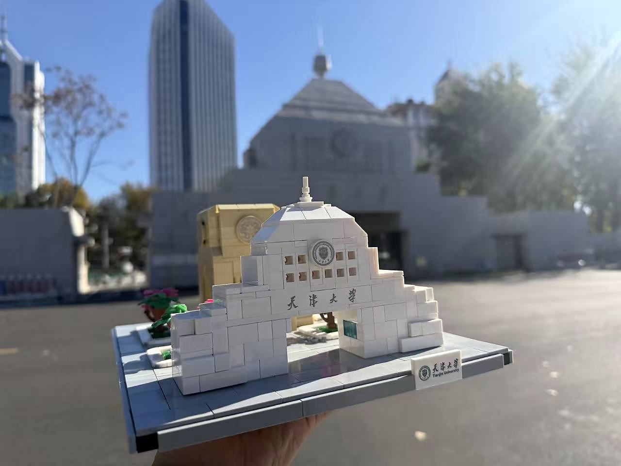 Peiyang Square building model held in front of the Tianjin University East Gate