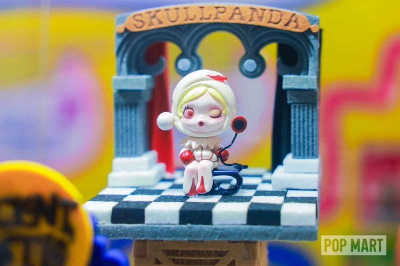 A collectible figure framed by a blue arch and checkerboard stage