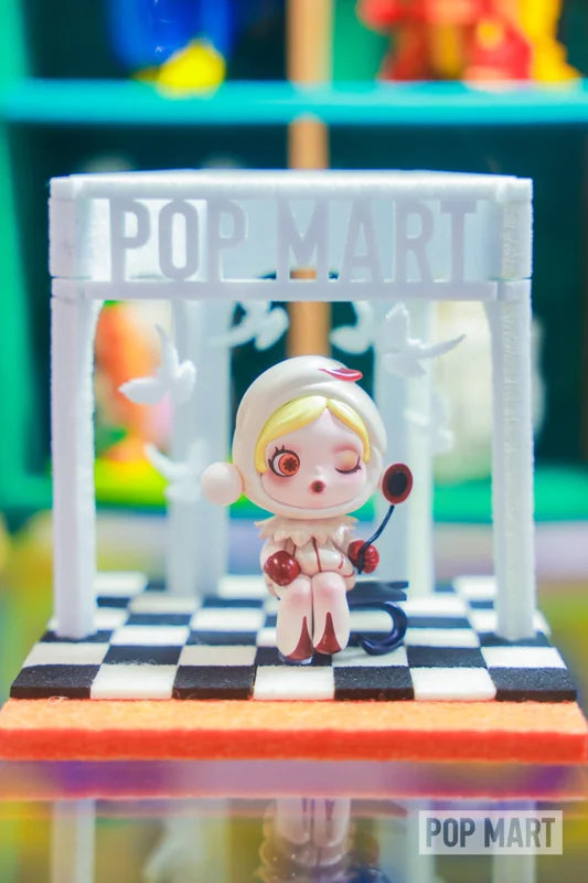 Collectible figure within a white column display