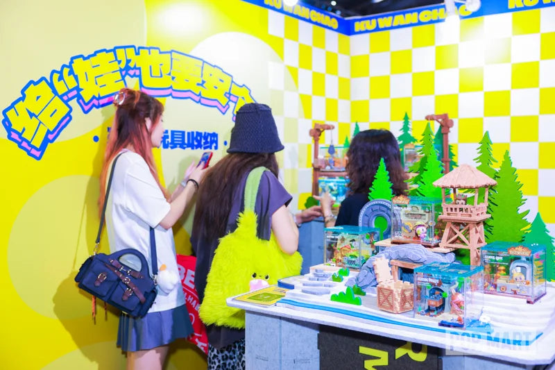 Visitors viewing display scenes at the Cool Toys Trend booth